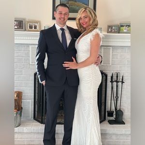 Fashion Nova high end - gorgeous white sparkly feathered at the sleeves.